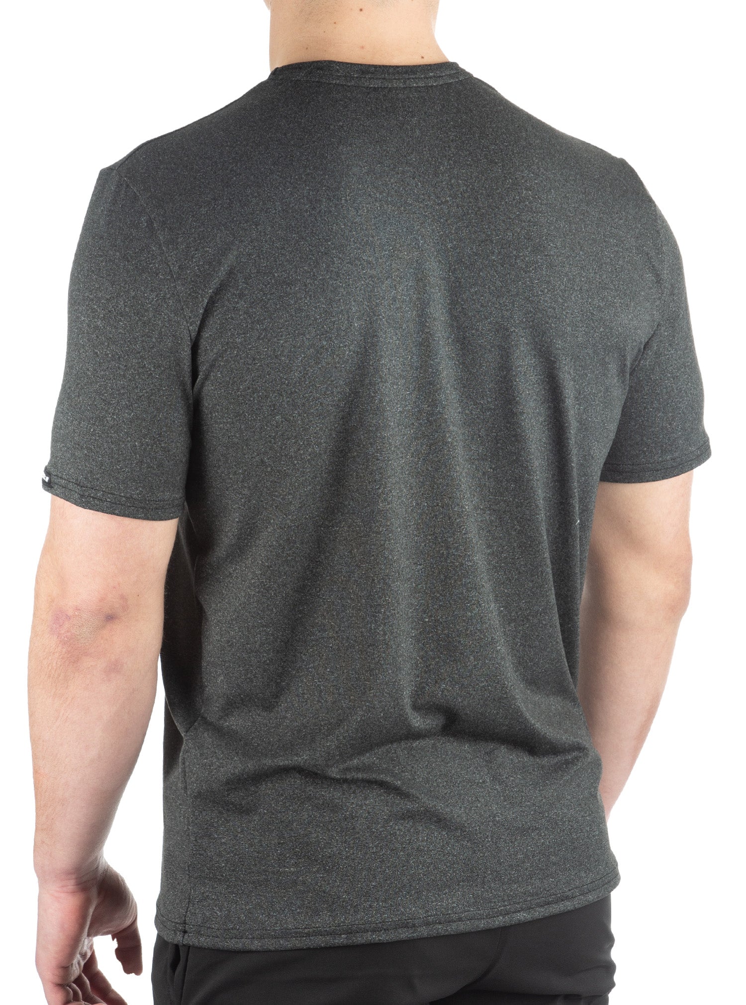 Gray t-shirt worn by a person on a white background