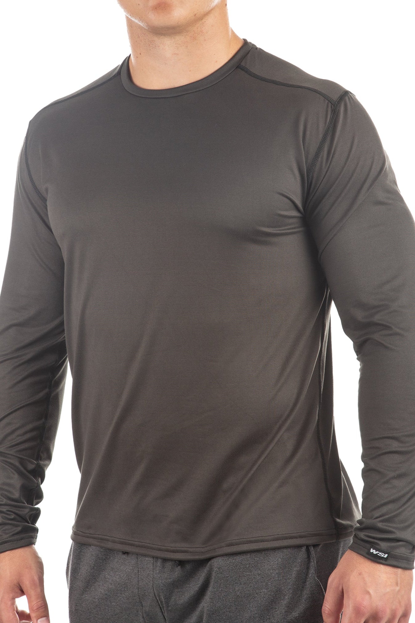Person wearing a gray long-sleeve athletic shirt on a white background