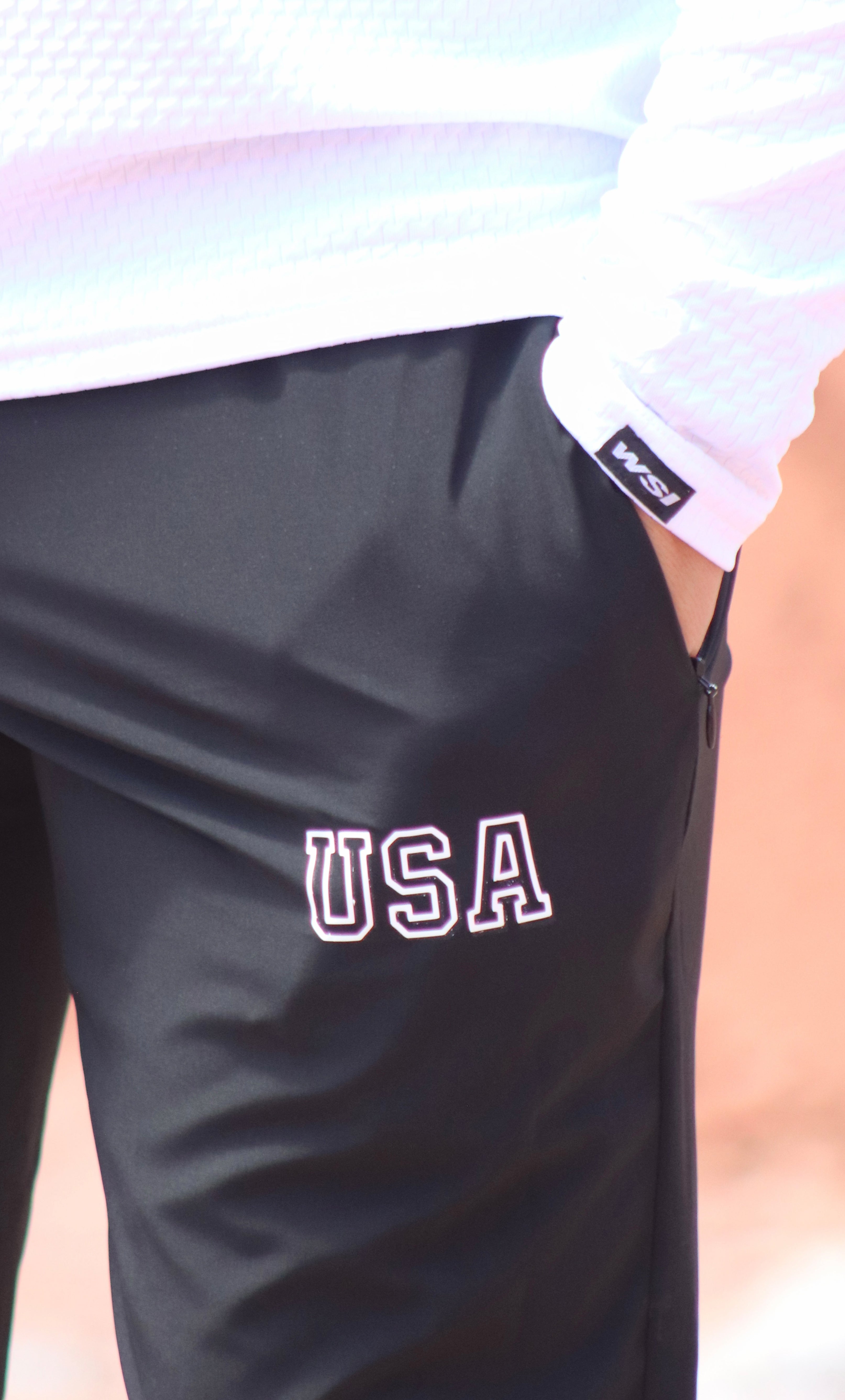 Black shorts with 'USA' text on a blurred background