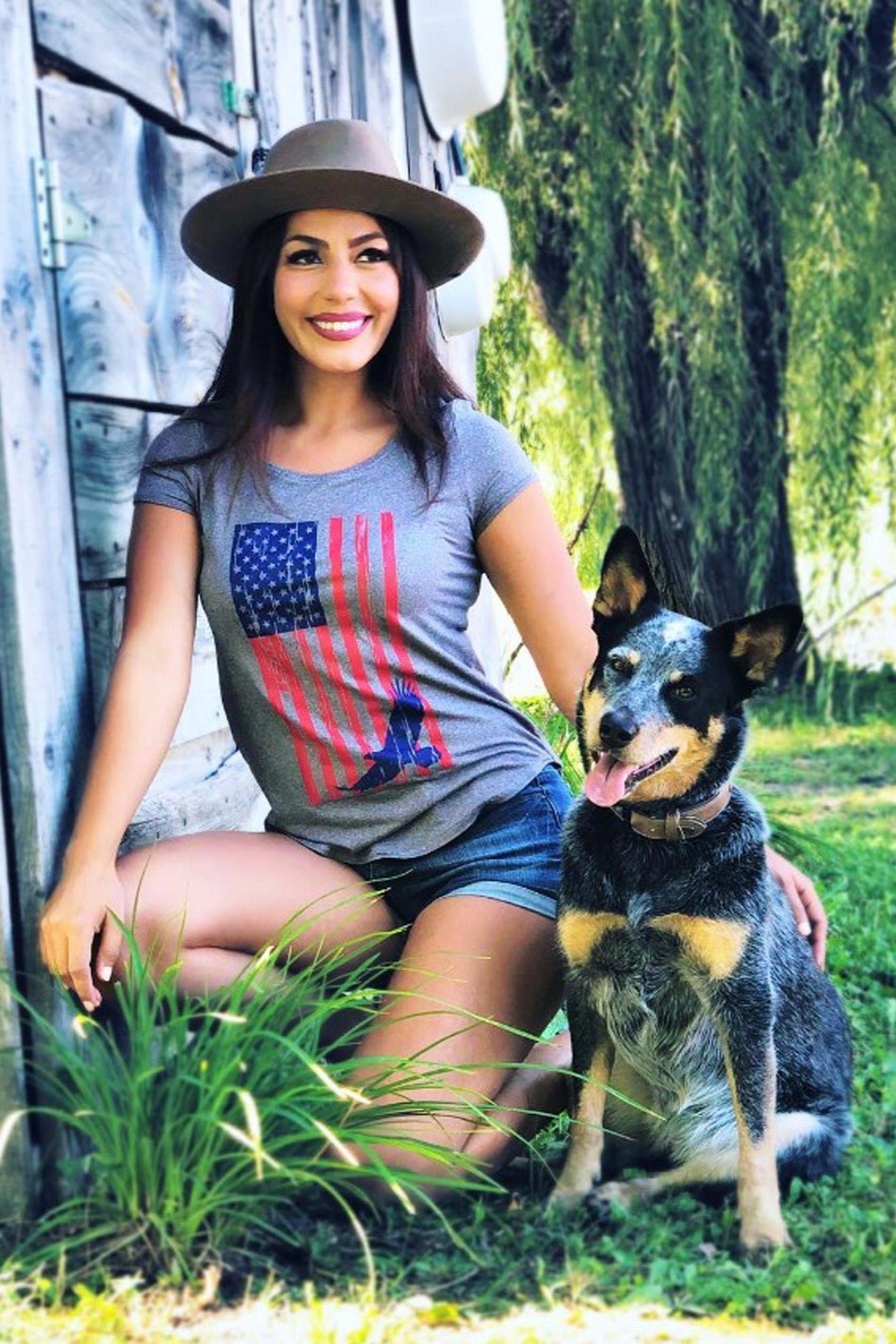 Women wearing a grey WSI Patriotic T-shirt and a Dog